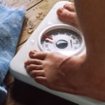 person on bathroom scale