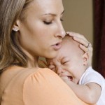 stress mother comforting crying baby