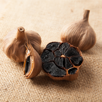 aged black garlic bulbs