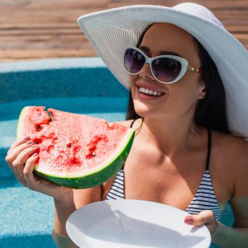 woman in sunshine wearing sunglasses