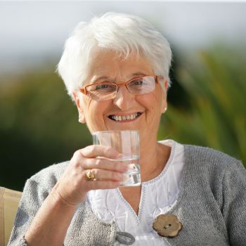 Senior Staying Hydrated by drinking water